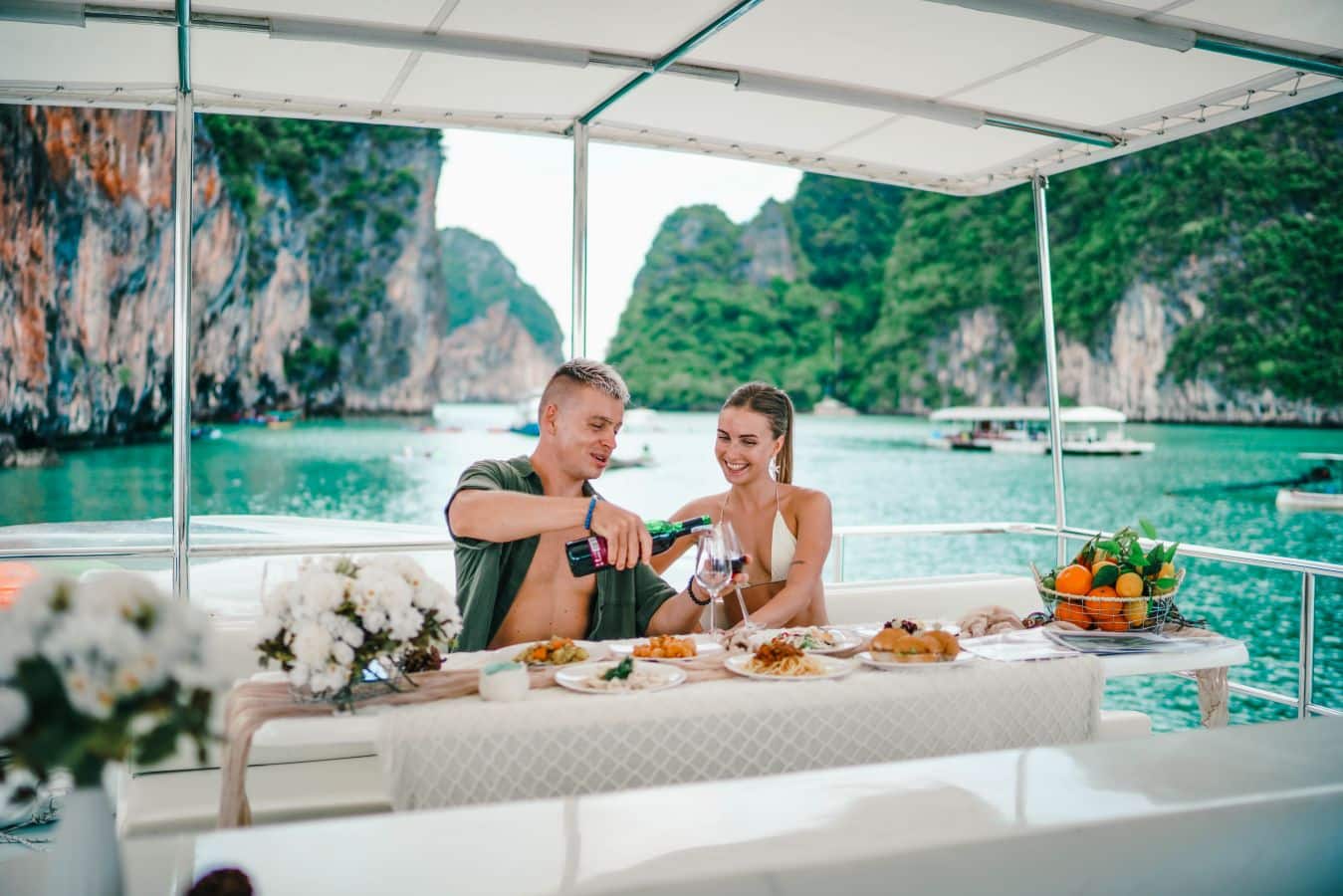Couple enjoy lunch on luxury boat Couple enjoy lunch on luxury boat
