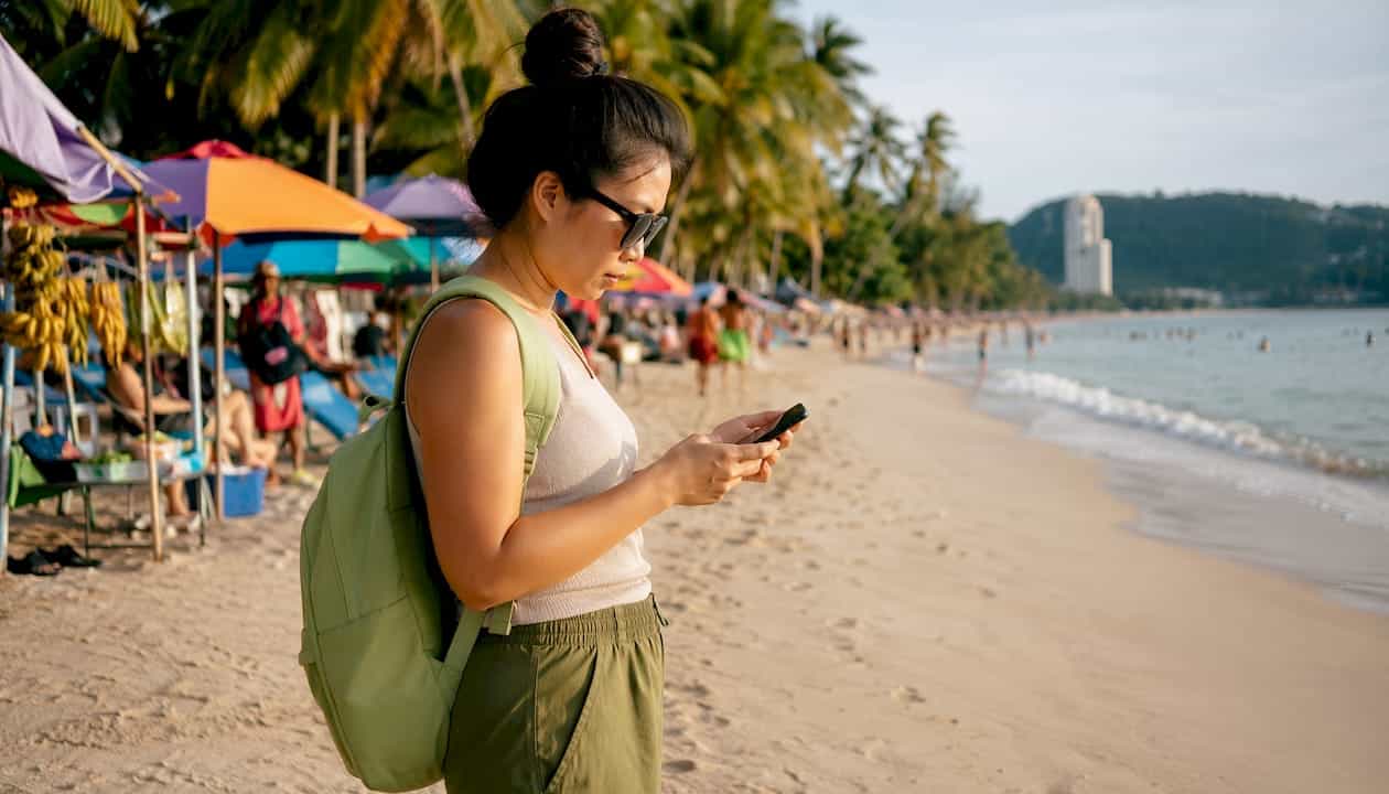 Traveler checking ferry timetable at Phuket pier