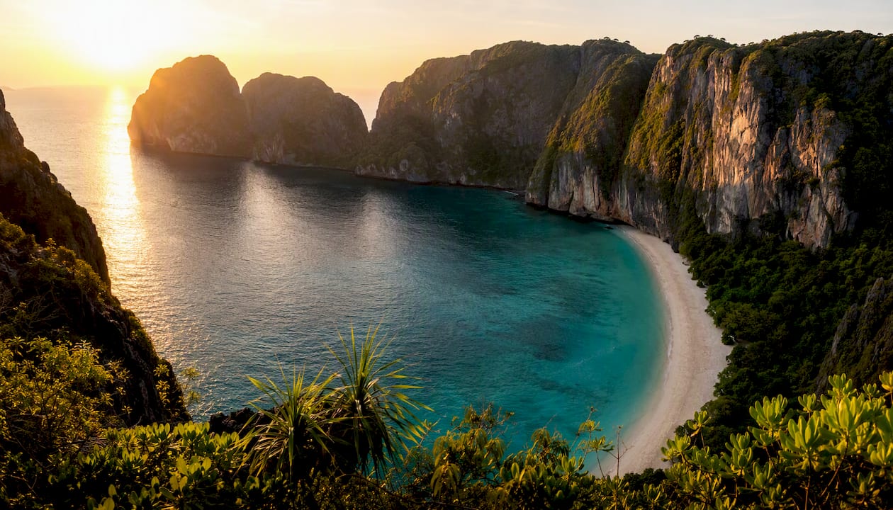 Aerial view of Maya Bay beach surrounded by cliffs