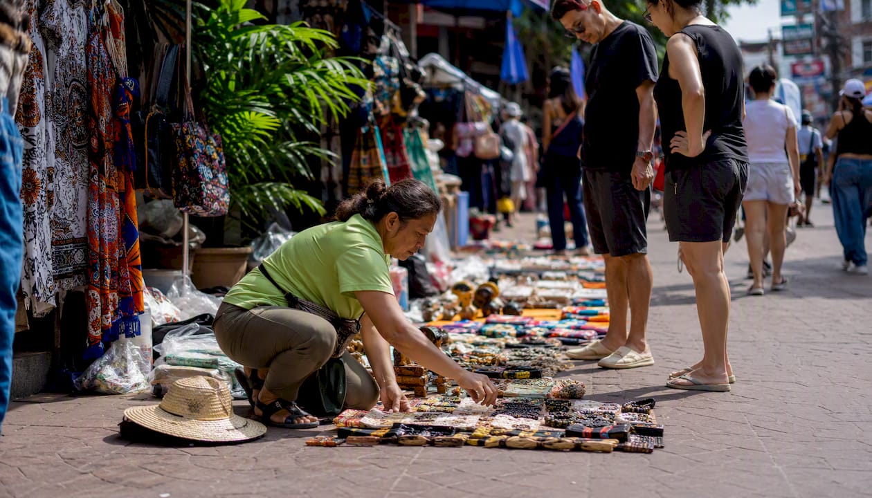 Street scene of Khao San Road market with pedestrians