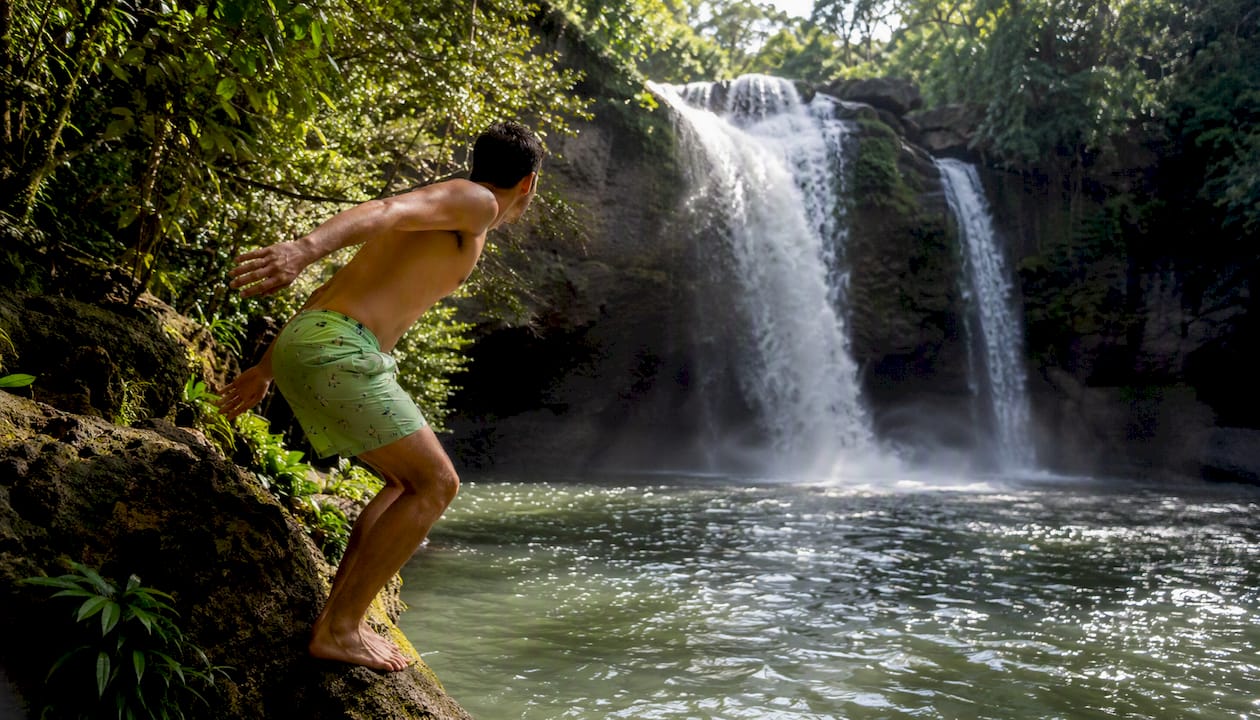 Haew Suwat Waterfall cascading in forest environment