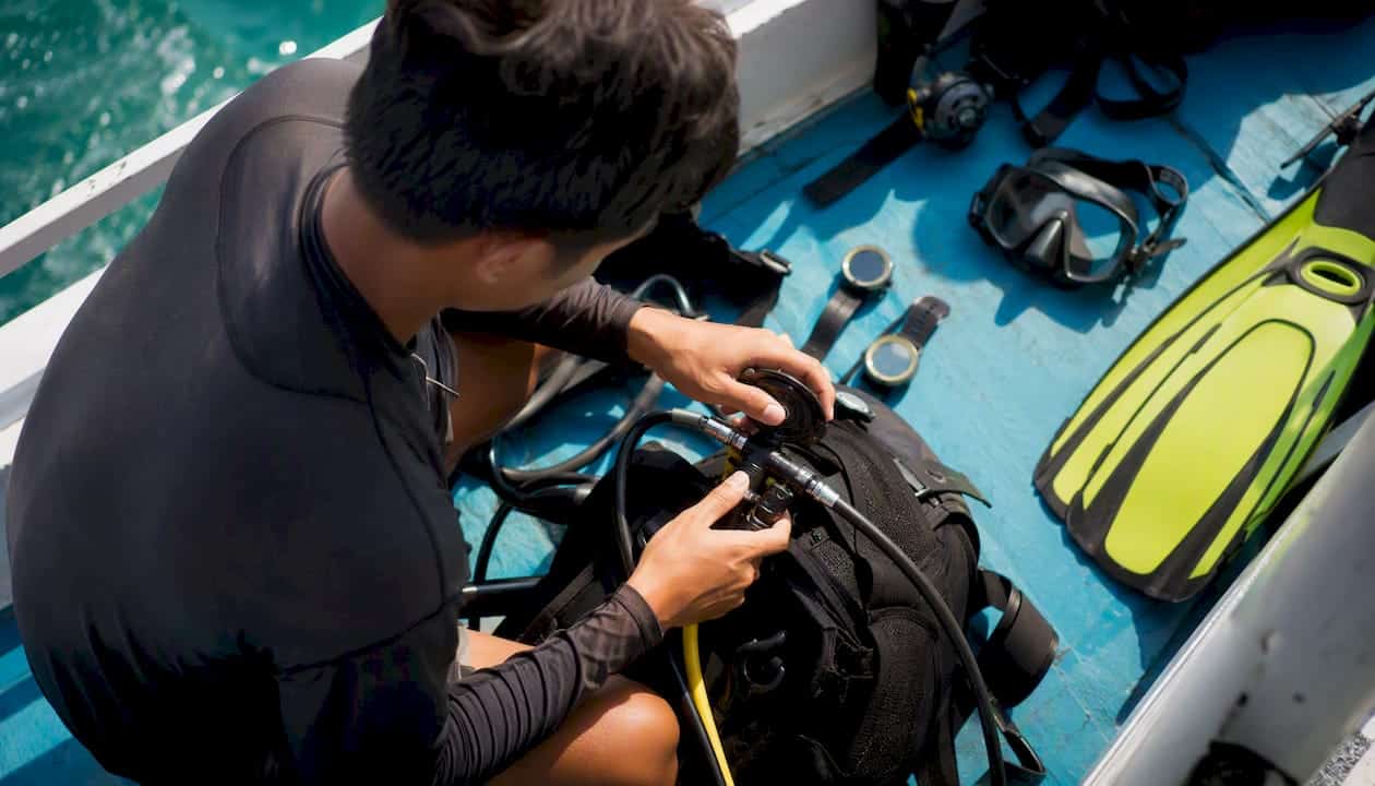 Scuba diving gear preparation on boat deck