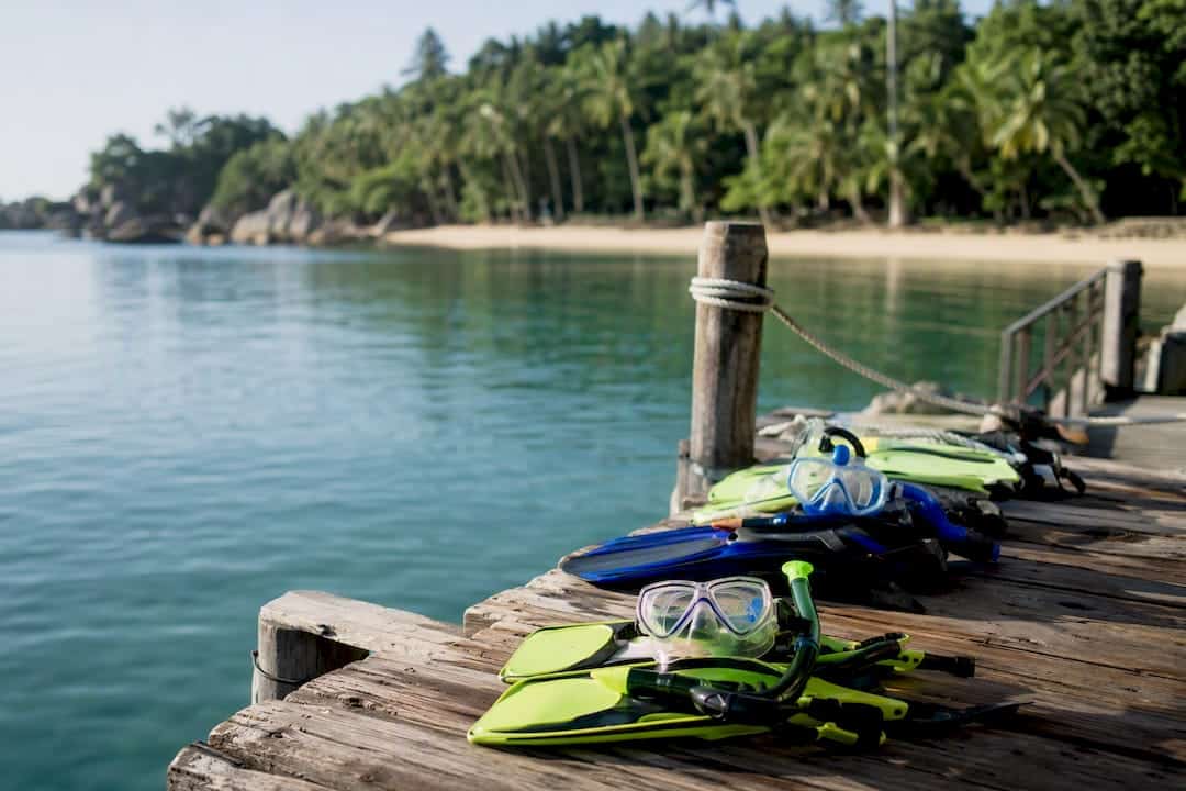 Snorkeling masks and fins on boat deck in Phuket