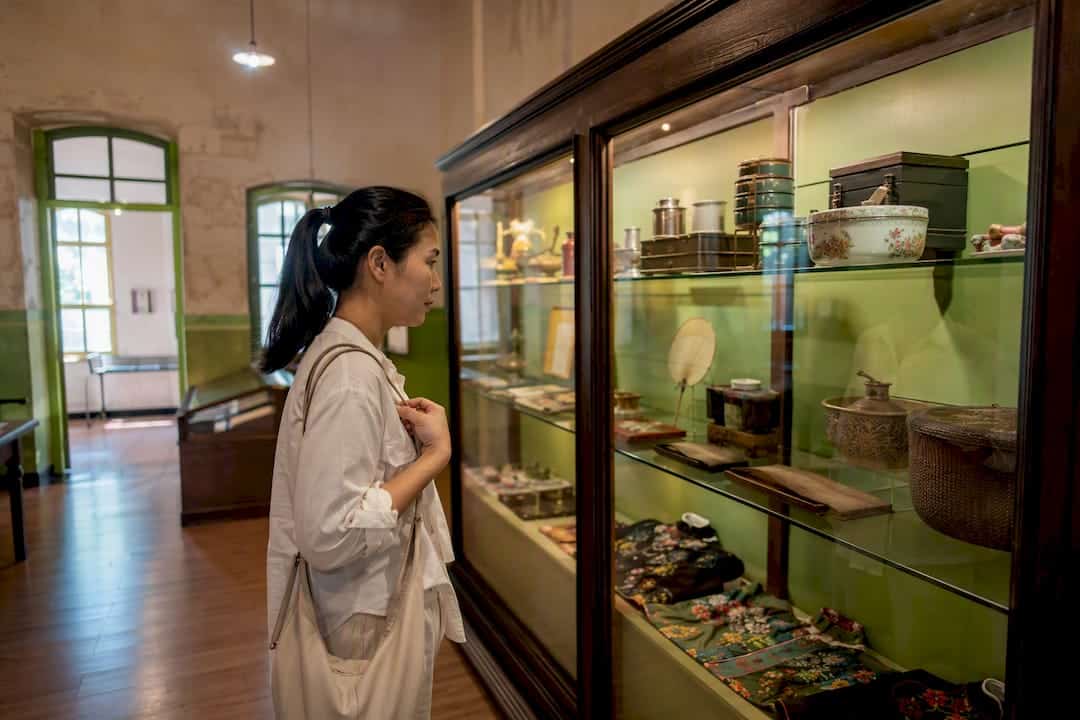 Visitor viewing Thai Hua Museum exhibits
