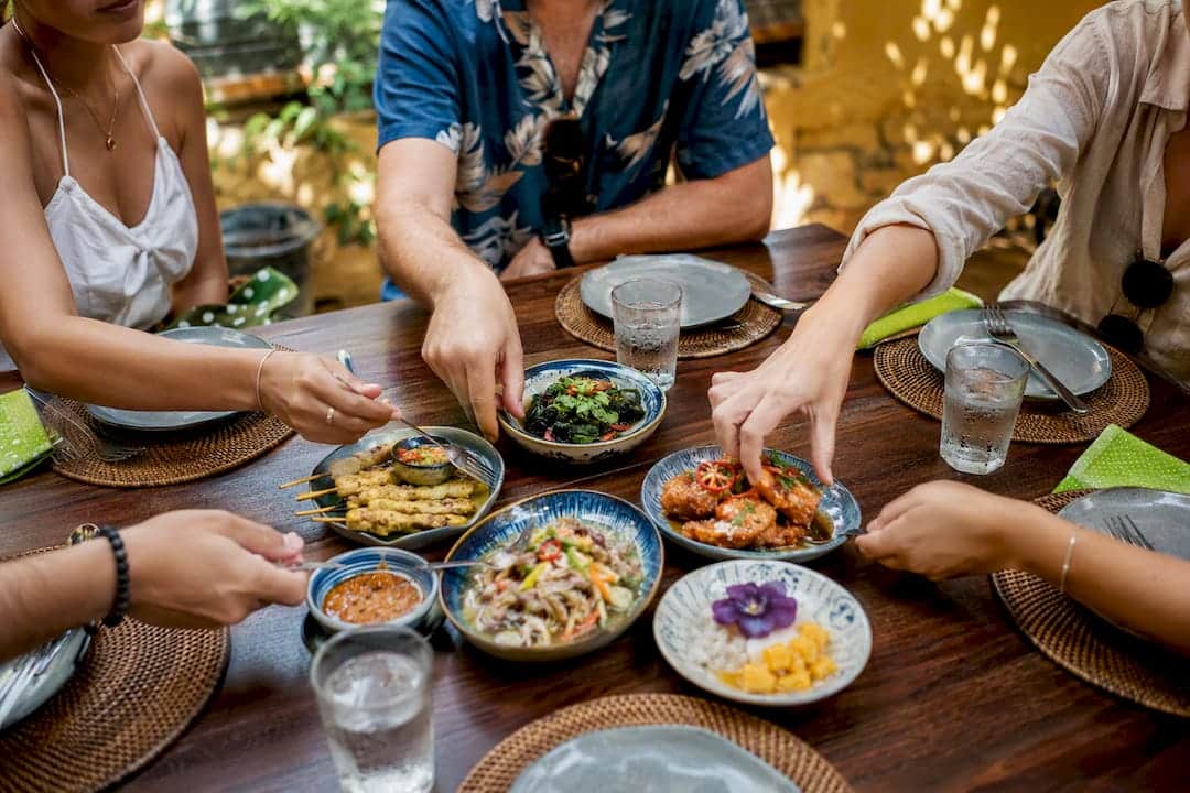 Small group sharing Thai food tastings