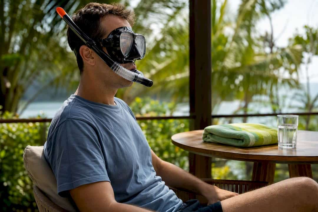 Beginner practicing snorkel breathing on land