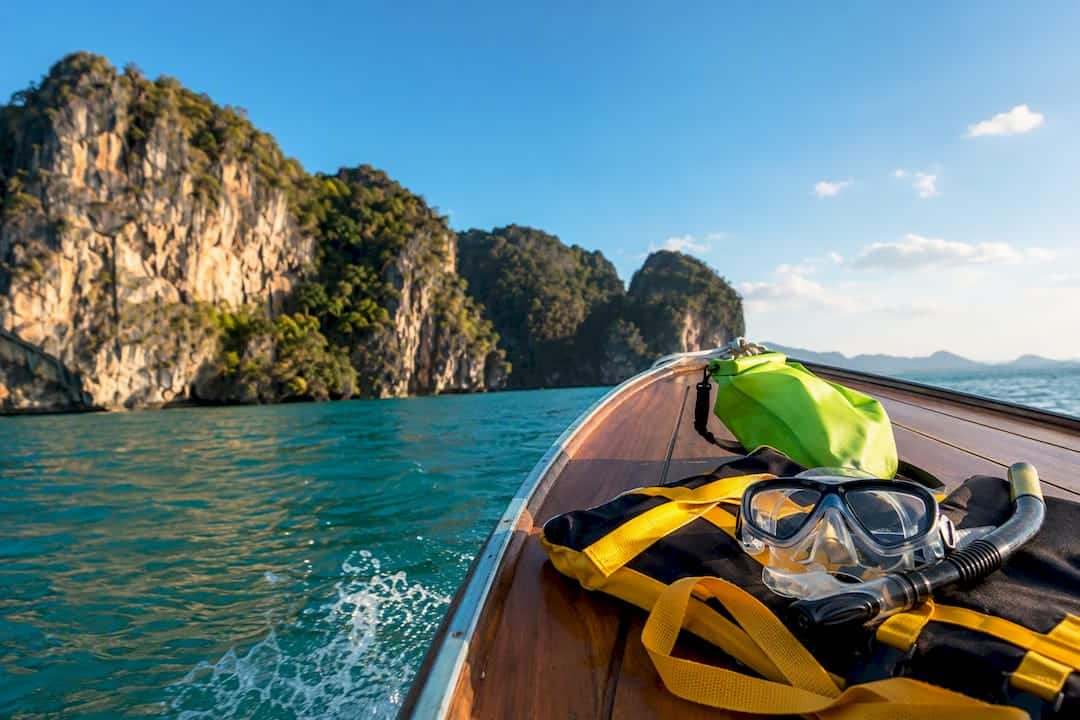 Boat approaching Phuket limestone islands