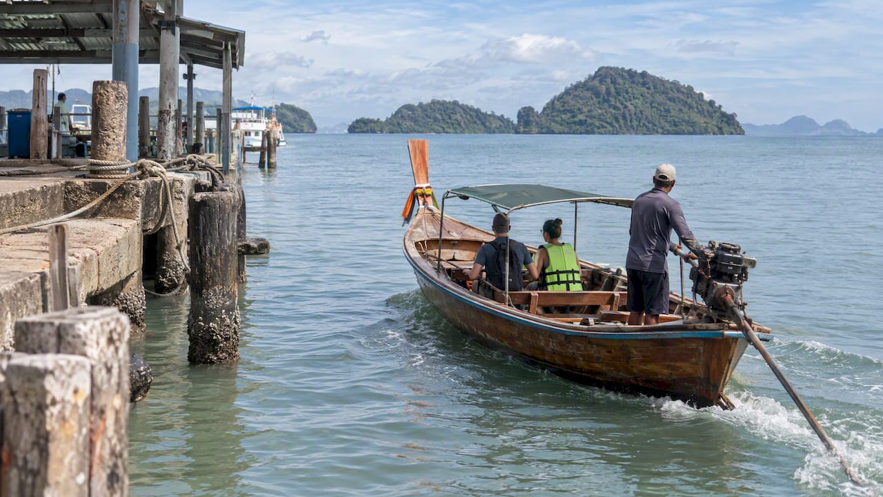 Longtail boat leaving Phuket for island hopping