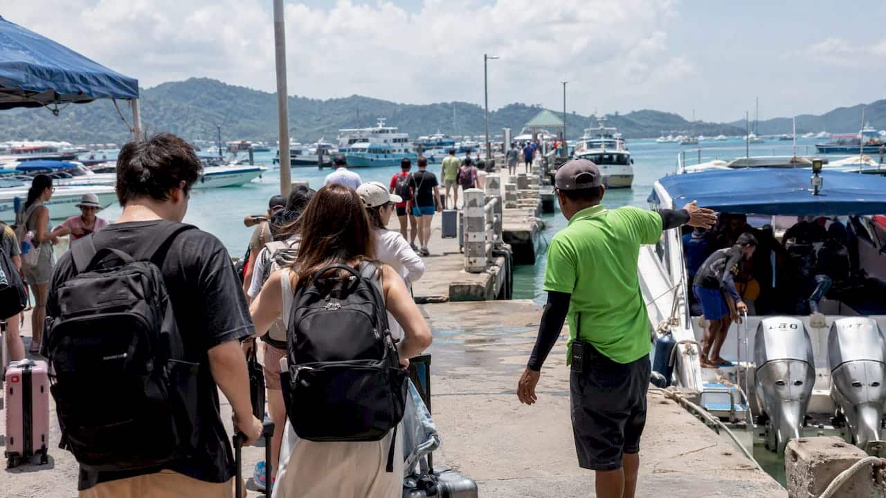 Passengers boarding boats at Chalong Pier