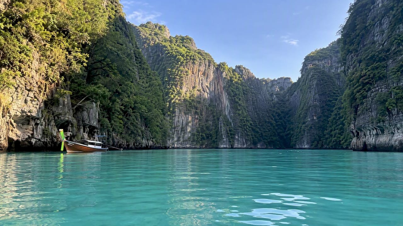 Calm Pileh Lagoon beneath limestone cliffs
