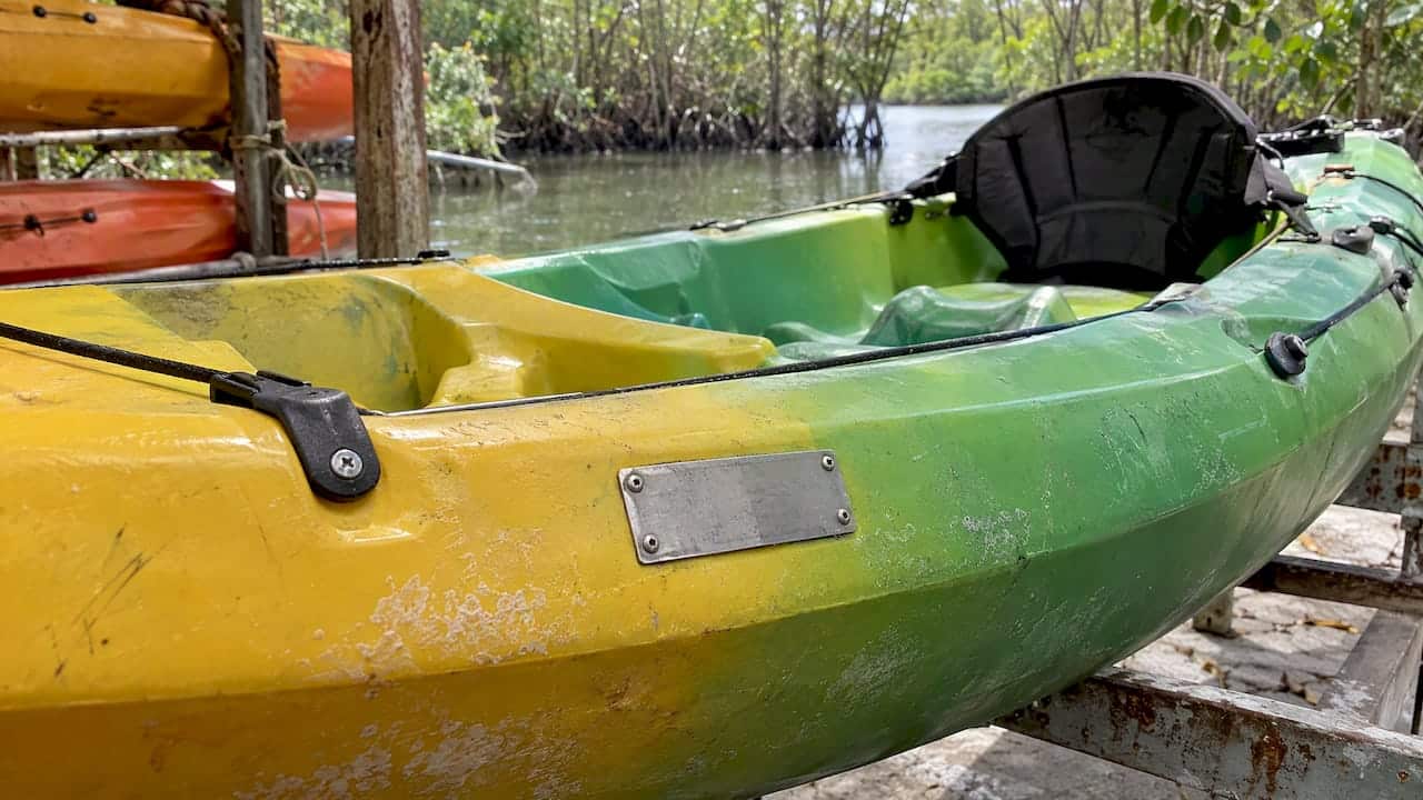 Capacity plate beside a kayak cockpit